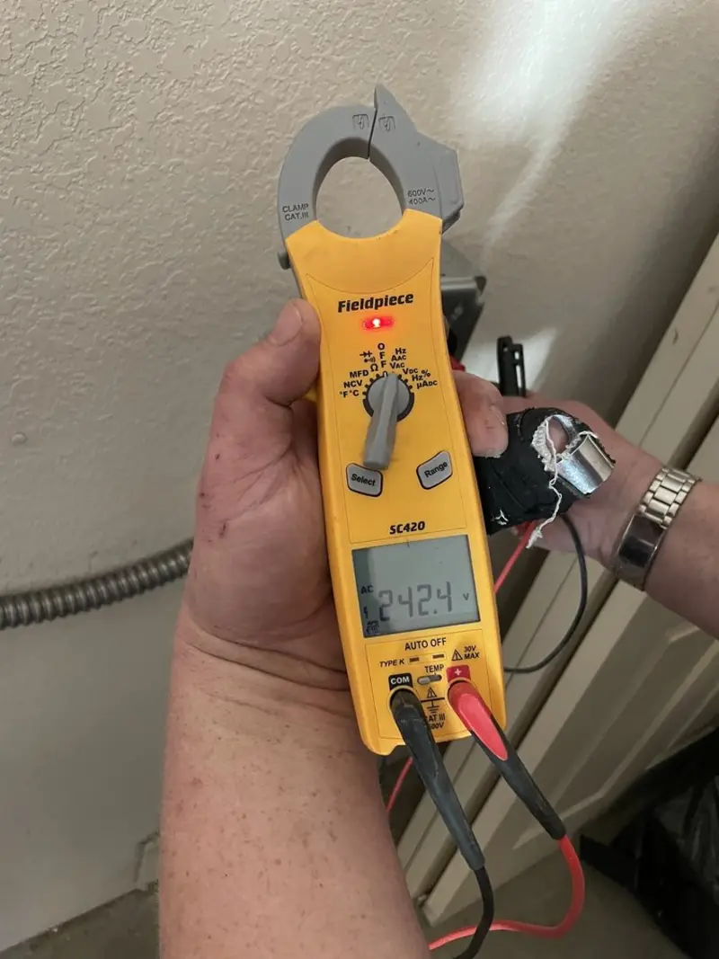 Voltage testing with clamp meter during Electrical Installation Services in North Smithfield